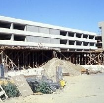 Site of the Downtown Plaza Parking Garage, Lot "G" near Macy's Department Store, 4th, 5th K and L Streets under construction. This view is looking east from the Fratt Building in Old Sacramento