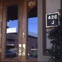 View of the west wall of the Traveler's Hotel after rehabilitation showing the front doorway