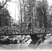 Soldier standing on a bridge