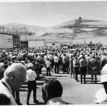 View of people gathered at the construction site of the A. D. Edmonston Pumping Plant. It is a pumping station near the south end of the California Aqueduct. It lifts water 1,926 feet to cross the Tehachapi Mountains