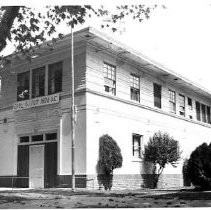 "Chemical House No. 2" [former fire station?] with large handwritten banner saying "Girl Scout House"