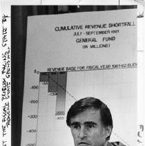 Governor Brown at podium "Gov. Brown & Vic Fazio (center) hold press conference after President has boarded A.F.1