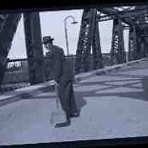 A young man standing on the I Street bridge