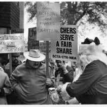 Demonstrators calling for more education funding near the Ponderosa Motor Lodge