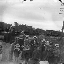 Large group of people at railroad tracks