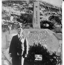 Duk Hyung Kim in front of a monument he build in South Korea in memory of Americans who died during the Korean War