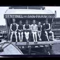 Six men sitting on a paddlelwheel