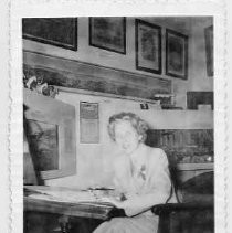 Irene Simpson (Neasham), 1949 sitting at a desk
