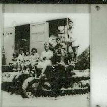 People seated on military tank