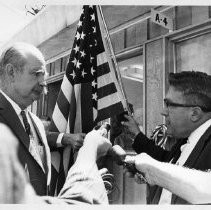 Jack Hickman, husband of Dr. Irene Hickman, an osteopath and the Sacramento County assessor, being interviewed by journalists