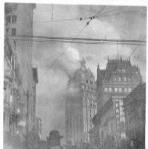 Untitled, San Francisco, post earthquake/fire. Tall building on fire at top with crowd in foreground