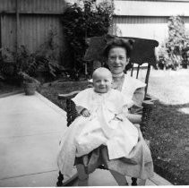 Unknown woman with child outdoors