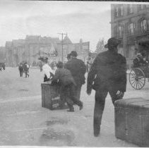 Dragging trunks from fire, Van Ness Ave., 9 A.M., 19th [April, 1906]