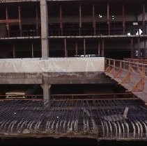 Site of the Downtown Plaza Parking Garage, Lot "G" near Macy's Department Store, 4th, 5th K and L Streets under construction. This view is looking east from the Fratt Building in Old Sacramento