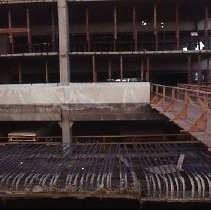 Site of the Downtown Plaza Parking Garage, Lot "G" near Macy's Department Store, 4th, 5th K and L Streets under construction. This view is looking east from the Fratt Building in Old Sacramento