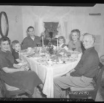 A family sitting around a Christmas table