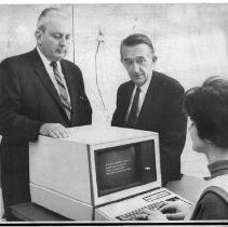 Caption reads: "New Law Enforcement Network--Attorney General, Thomas C. Lynch, center and O. J. Hawkins, deputy director of the State Department of Justice discuss new California enforcement system