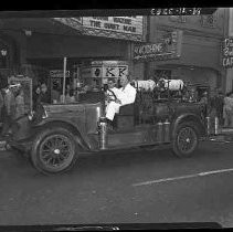 A fire engine parked in front of the Fox Senator theater