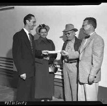 A man being given a check