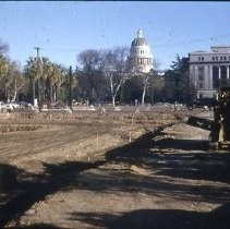 Views of redevelopment sites, renderings, and table models for the proposed Redevelopment District. Includes maps and site plans