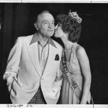 Bob Hope, the legendary comedian and movie and TV star, gets a kiss from Maid of California Kimberly Dewing of Ventura County, who reigns over the California State Fair