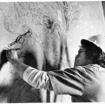 View of Michael Casey, a resident sculptor as he traces out a Griffin complete with wings and spitting fire. He is part of the team restoring the California State Capitol building