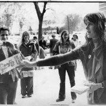 Jane Fonda handing out flyers