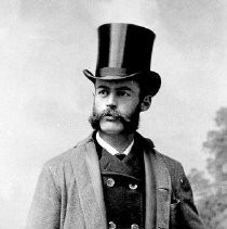 Geo. D. Allen in Top Hat and Overcoat