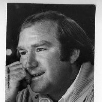 Bob Lunn, pro golfer, resting his hand on his hand