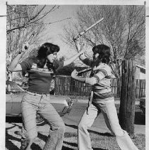 Vanessa Gorre, 1976 Camellia Queen, plays Escrima, an ancient form of self-defense from the Philippines, with her sister Charissa (right, age 14)