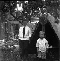 Portrait of a two boys near trees