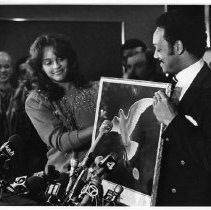 Jesse Jackson, the civil rights activist, founder of Rainbow/PUSH, and Baptist minister who ran for president in 1984 and 1988 and served as the first U.S. Shadow Senator from D.C. Here, actress Jayne Kennedy presents him with a painting