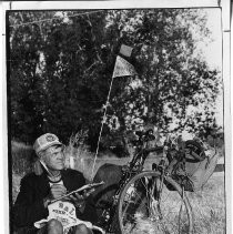 Cyclist Bill Marquardt with his gear and bike, spending the night in Discovery Park