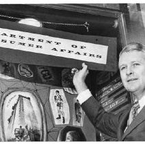 Caption reads: "Same office--New Name