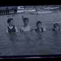 Young men swimming