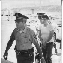 Juan Corona, in the center seen entering hospital for an EKG. He is an accused mass murderer