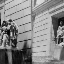 Women climbing on the Mineral Wealth Statue