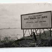 A billboard advertising the construction of the Bing Maloney golf course