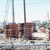 Site of the Downtown Plaza Parking Garage, Lot "G" near Macy's Department Store, 4th, 5th K and L Streets under construction. This view is looking east from the Fratt Building in Old Sacramento