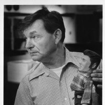 Ed Hartman of Records holds a 1956 $1000 Elvis doll