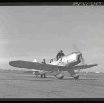 An airplane with pilot and passenger