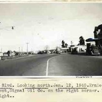 Del Paso Blvd. Looking north. Jan. 12, 1940. Ernie Hawes, agent, Signal Oil Co. on the right corner. Hotel N. Sacto on the right