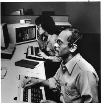 Interior view of new Sacramento police and firefighter dispatch center, with Kathie Leon-Duarte and Chuck Thompson working at computers