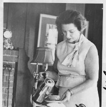 Mrs. Frank M. (Alberta) Jordan, pouring a cup of coffee