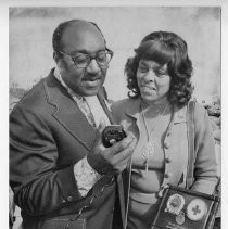 Mr. and Mrs. Bob Johnson, members of a Sacramento Red Cross disaster team, are presented a plaque by United Way in reconition of their actions following a fatal auto crash. They aided the family of a man who died in the crash