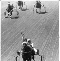 Dick Farrington shown setting a world record of 1:53 1/5 horse was "Warm Breeze"