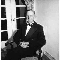 Unidentified man sitting in an armchair