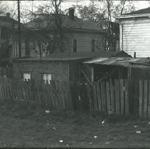 Views of redevelopment sites, renderings, and table models for the proposed Redevelopment District. Includes maps and site plans