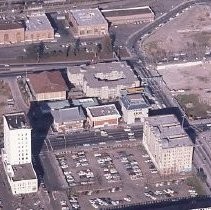 Views of redevelopment sites showing the demolition of buildings and reconstruction in the district. This is an aerial view of the New Chinatown looking north