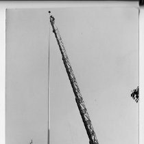Exterior view of the western entrance of the California State Capitol building showing the installation of the flagpole